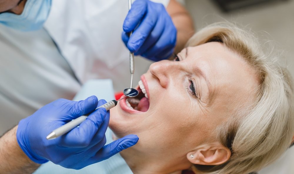 Closeup Female Patient Dentist